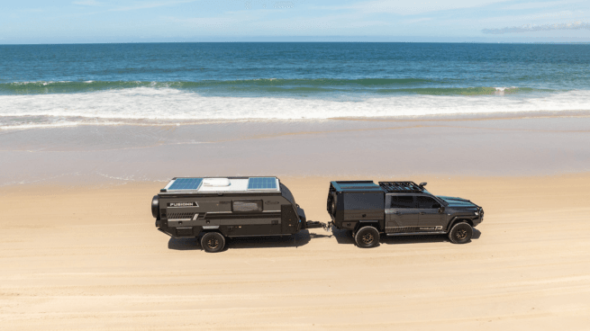 Custom Land Cruiser and Fusionn Van Driving on Beach