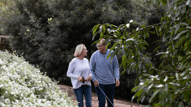 Lisa and her husband tour the garden