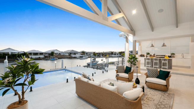 Outdoor Living and Kitchen Overlooking Pool and Canal